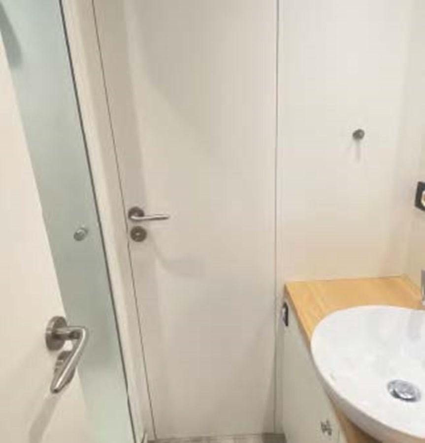 a white door with a sink aboard LADY NORA Yacht for Sale