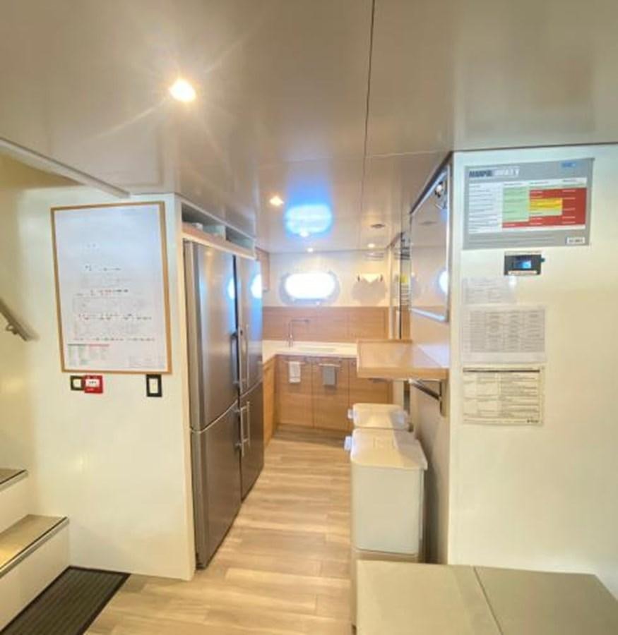 a large kitchen with a large refrigerator aboard LADY NORA Yacht for Sale