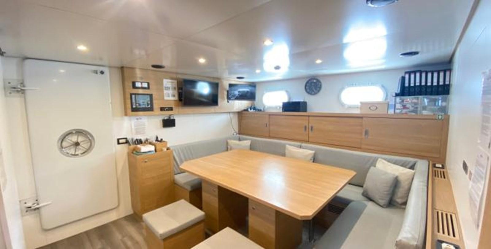 a room with a couch and a table aboard LADY NORA Yacht for Sale