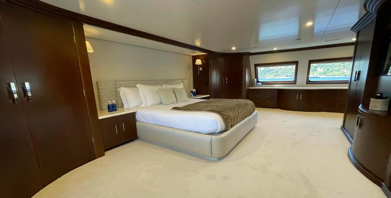 a room with a bed and a tv aboard LADY NORA Yacht for Sale