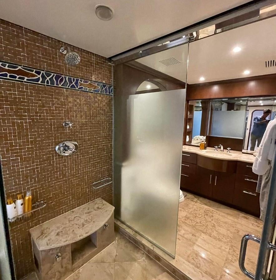 a bathroom with a brick wall aboard LADY NORA Yacht for Sale