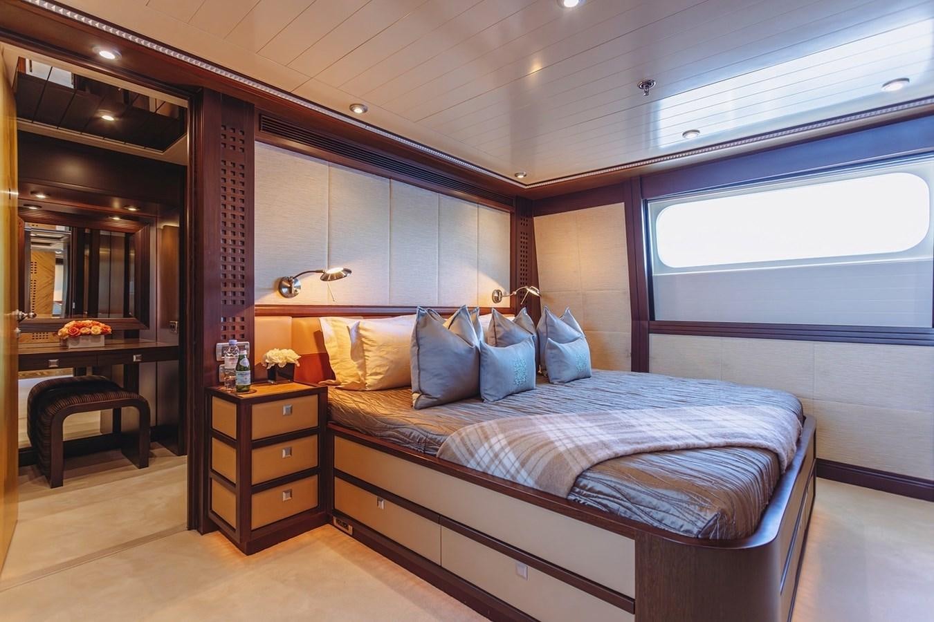 a bed in a room aboard AD LIB Yacht for Sale