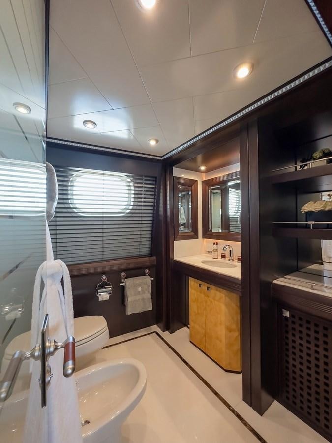 a bathroom with a sink and a mirror aboard AD LIB Yacht for Sale