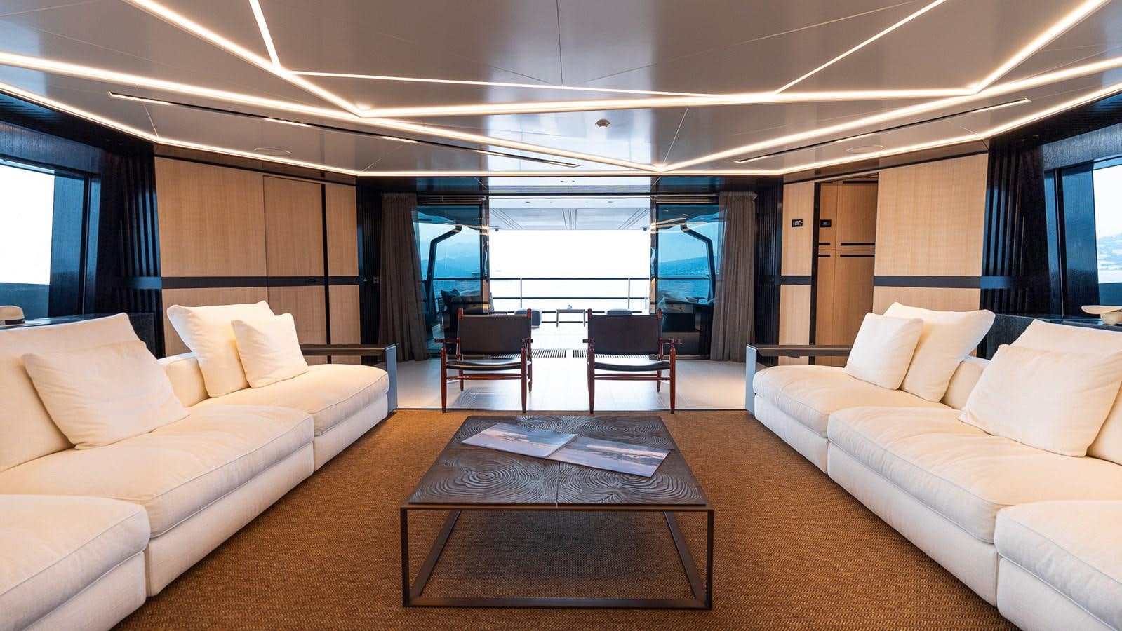 a living room with a large window aboard LASTOCHKA Yacht for Sale