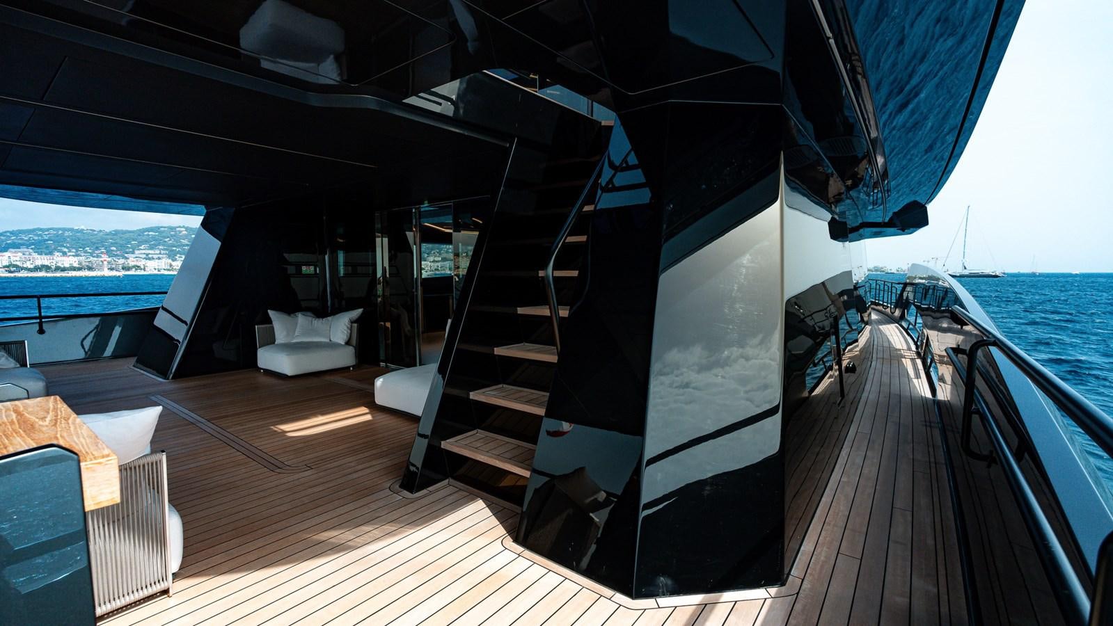 a deck with a large slide aboard LASTOCHKA Yacht for Sale