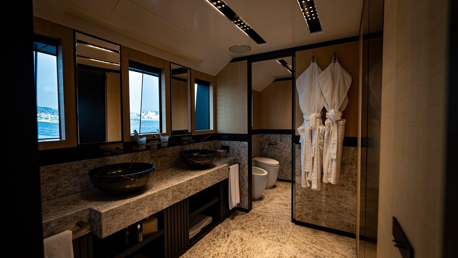 a bathroom with a sink and a mirror aboard LASTOCHKA Yacht for Sale