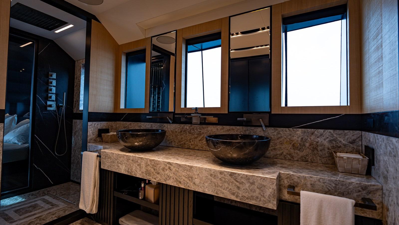 a kitchen with marble counter tops aboard LASTOCHKA Yacht for Sale