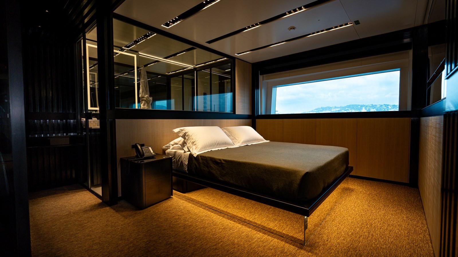 a large bed in a room aboard LASTOCHKA Yacht for Sale