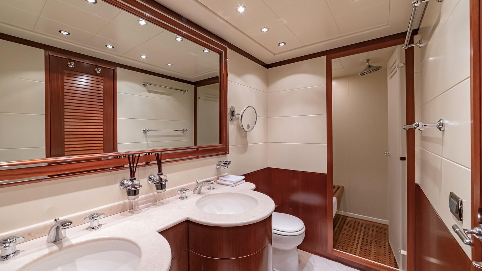 a bathroom with a large mirror aboard POPEYE Yacht for Sale