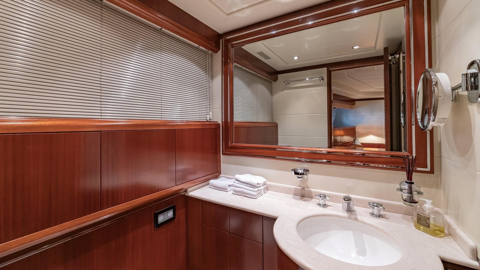 a bathroom with a large mirror aboard POPEYE Yacht for Sale