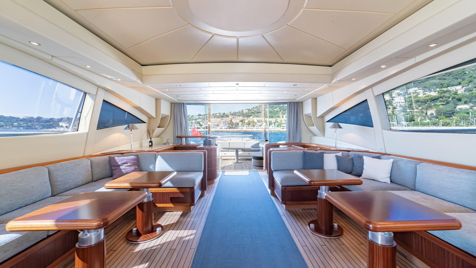 a room with couches and tables aboard POPEYE Yacht for Sale