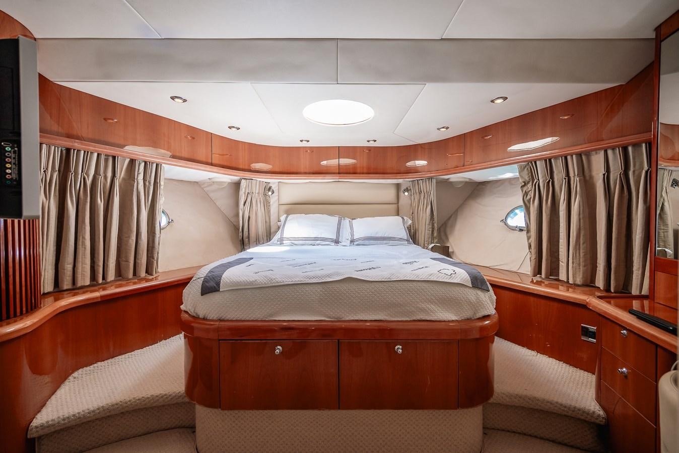 a room with a bed and a television aboard BAR.CO Yacht for Sale