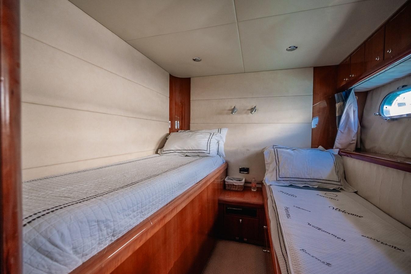 a small room with two beds aboard BAR.CO Yacht for Sale