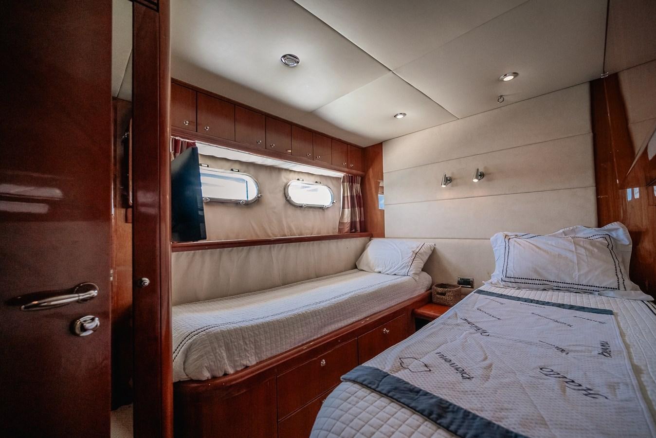 a room with a bed and a closet aboard BAR.CO Yacht for Sale