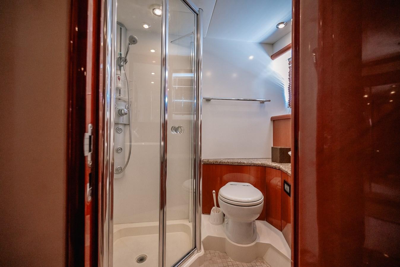 a bathroom with a glass shower aboard BAR.CO Yacht for Sale
