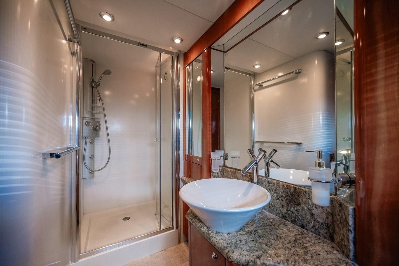 a bathroom with a large mirror aboard BAR.CO Yacht for Sale