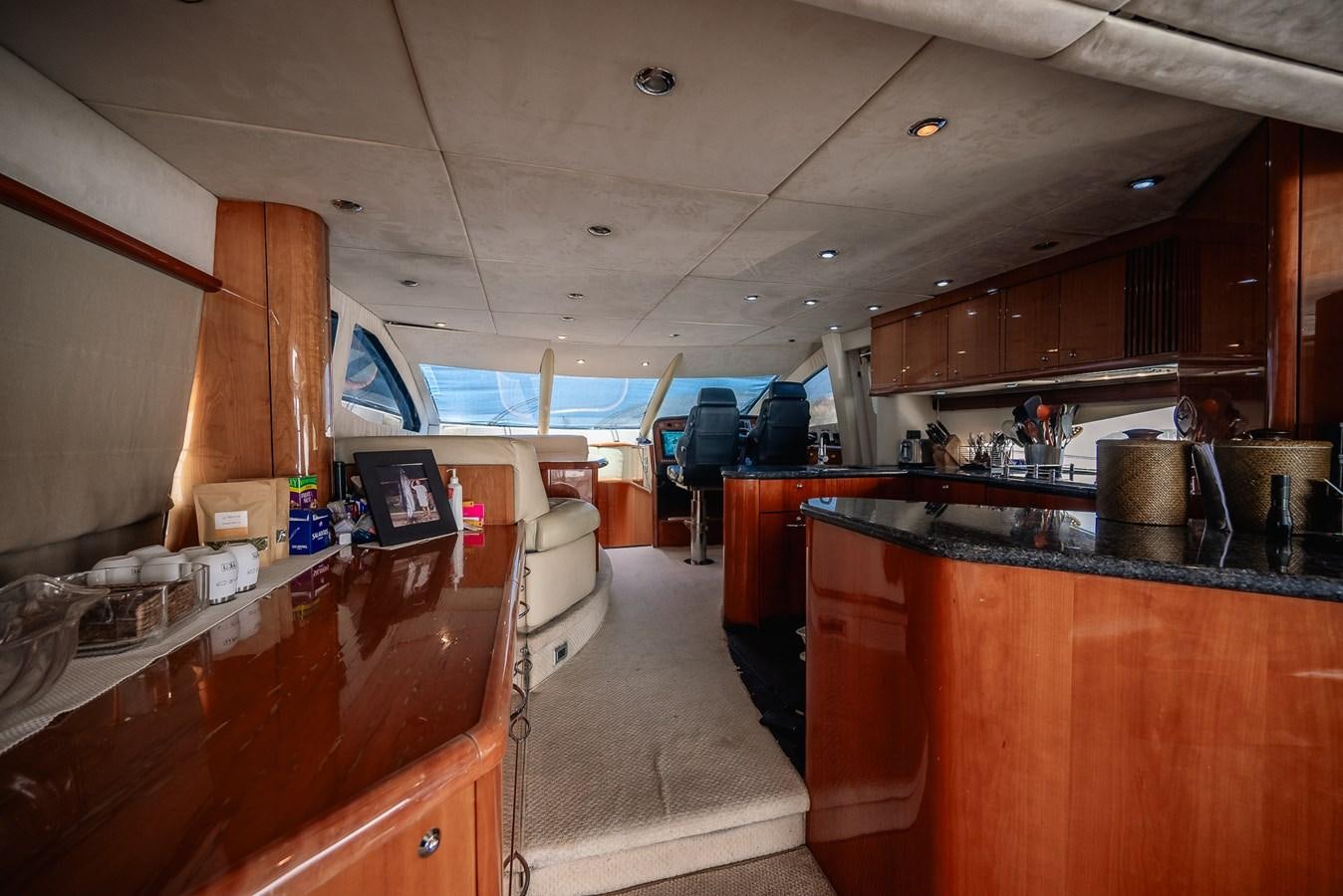 a kitchen with wooden cabinets aboard BAR.CO Yacht for Sale
