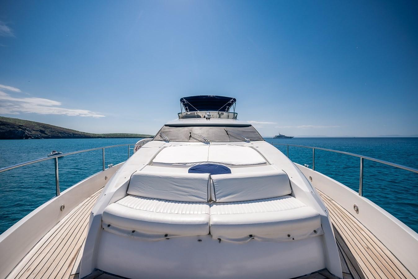 a white boat on a body of water aboard BAR.CO Yacht for Sale