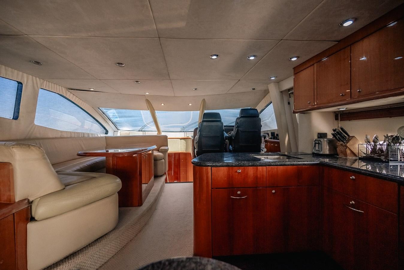 a kitchen with a large window aboard BAR.CO Yacht for Sale