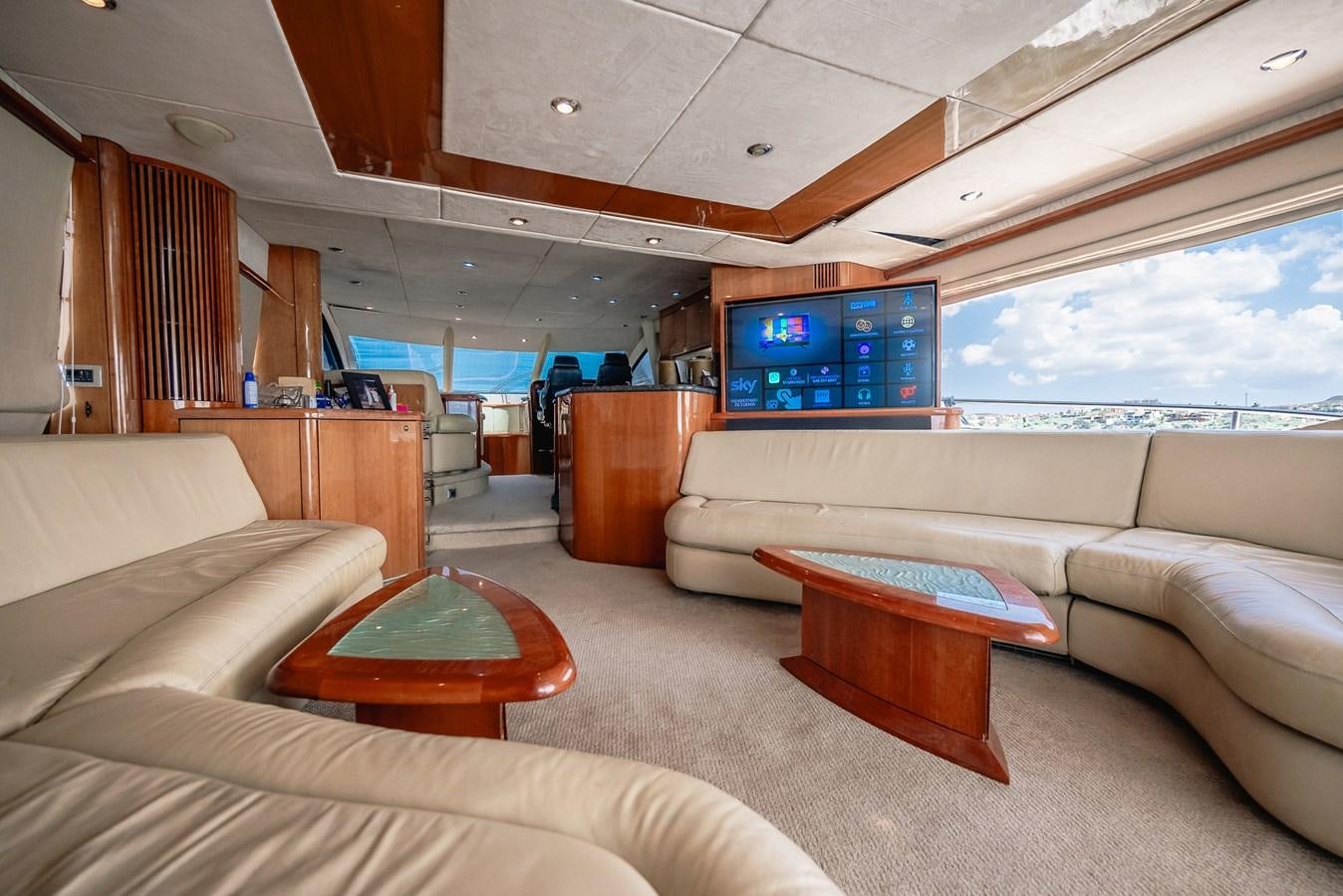 a living room with a couch and a tv aboard BAR.CO Yacht for Sale