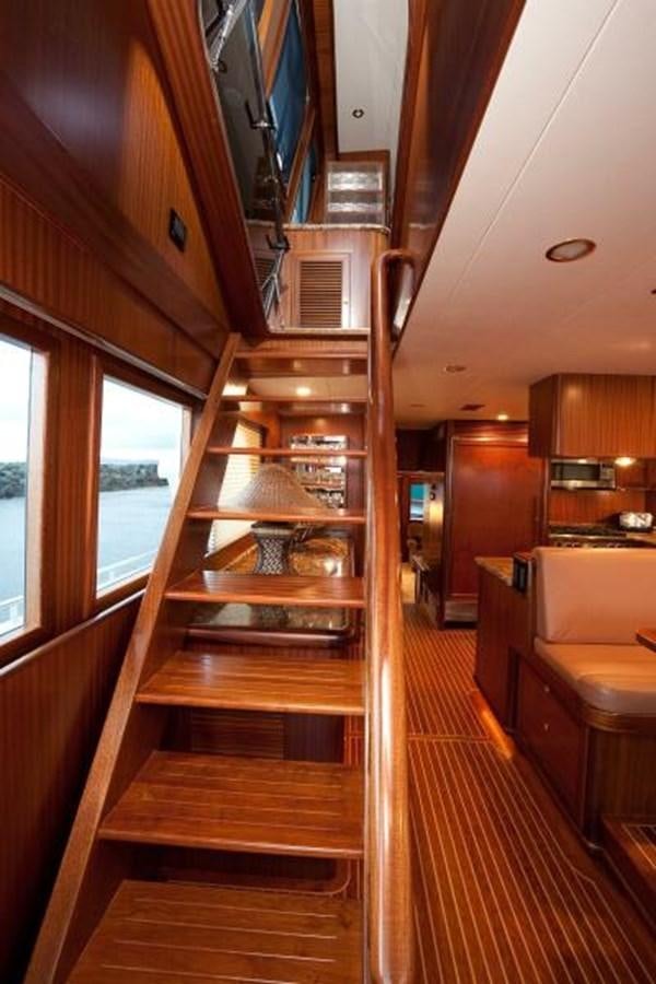 a wooden staircase in a house aboard AL DI LA Yacht for Sale