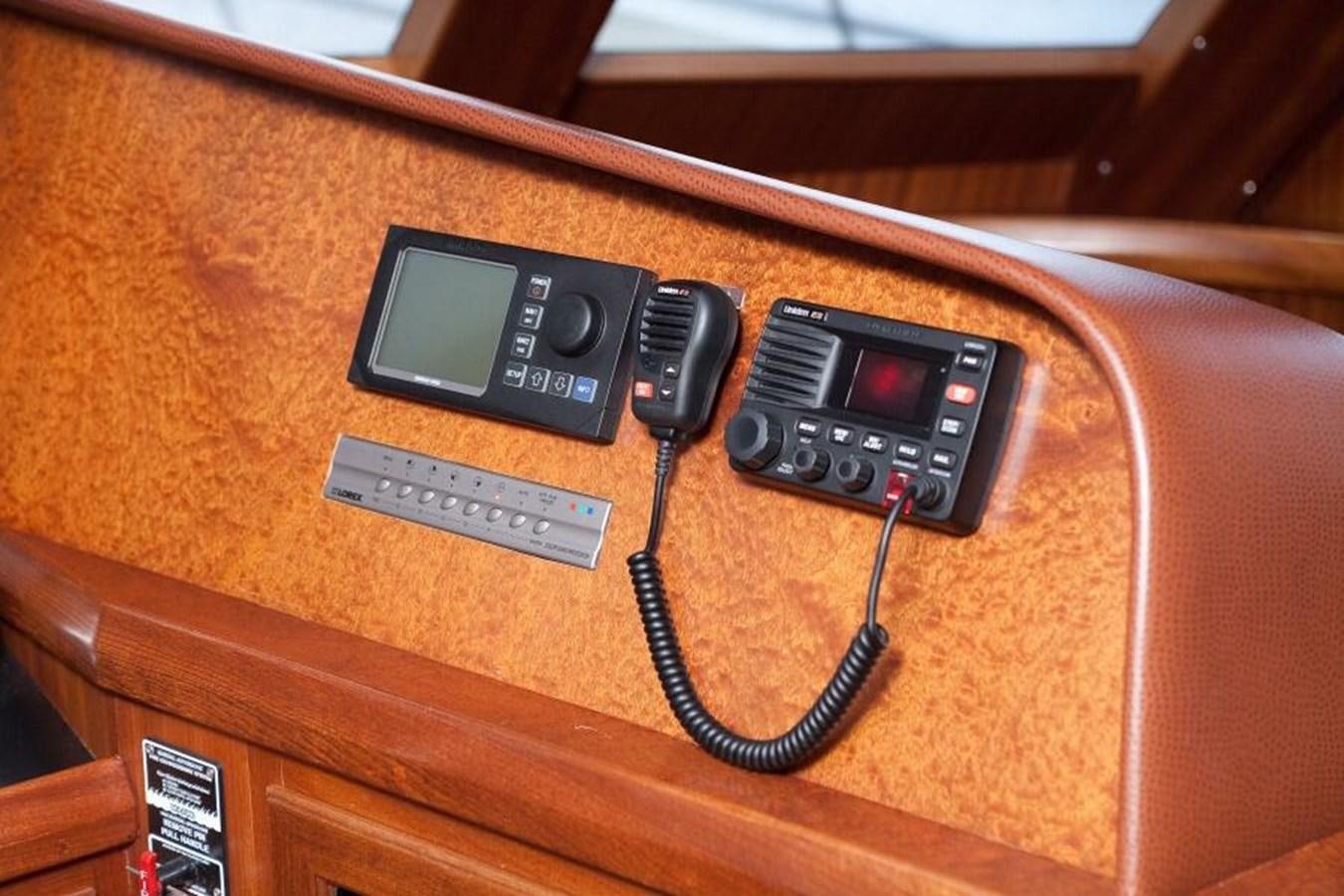 a couple of cell phones on a table aboard AL DI LA Yacht for Sale