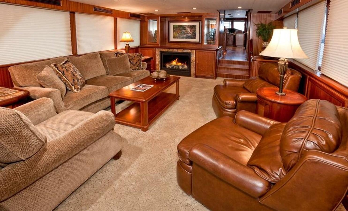 a living room with a fireplace aboard AL DI LA Yacht for Sale