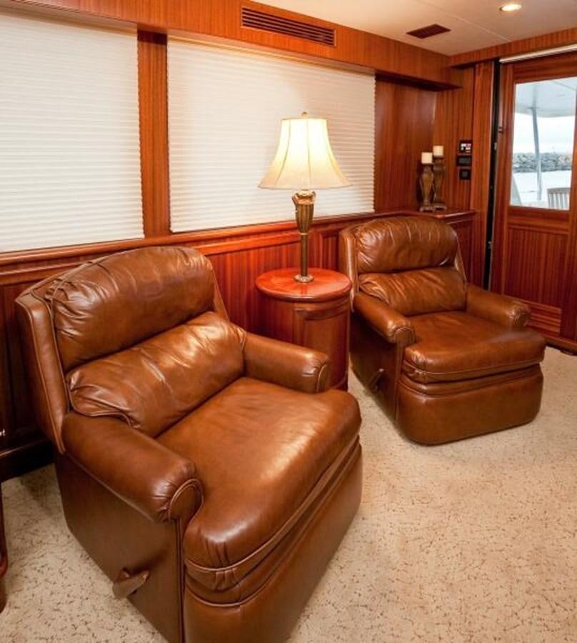a living room with leather furniture aboard AL DI LA Yacht for Sale