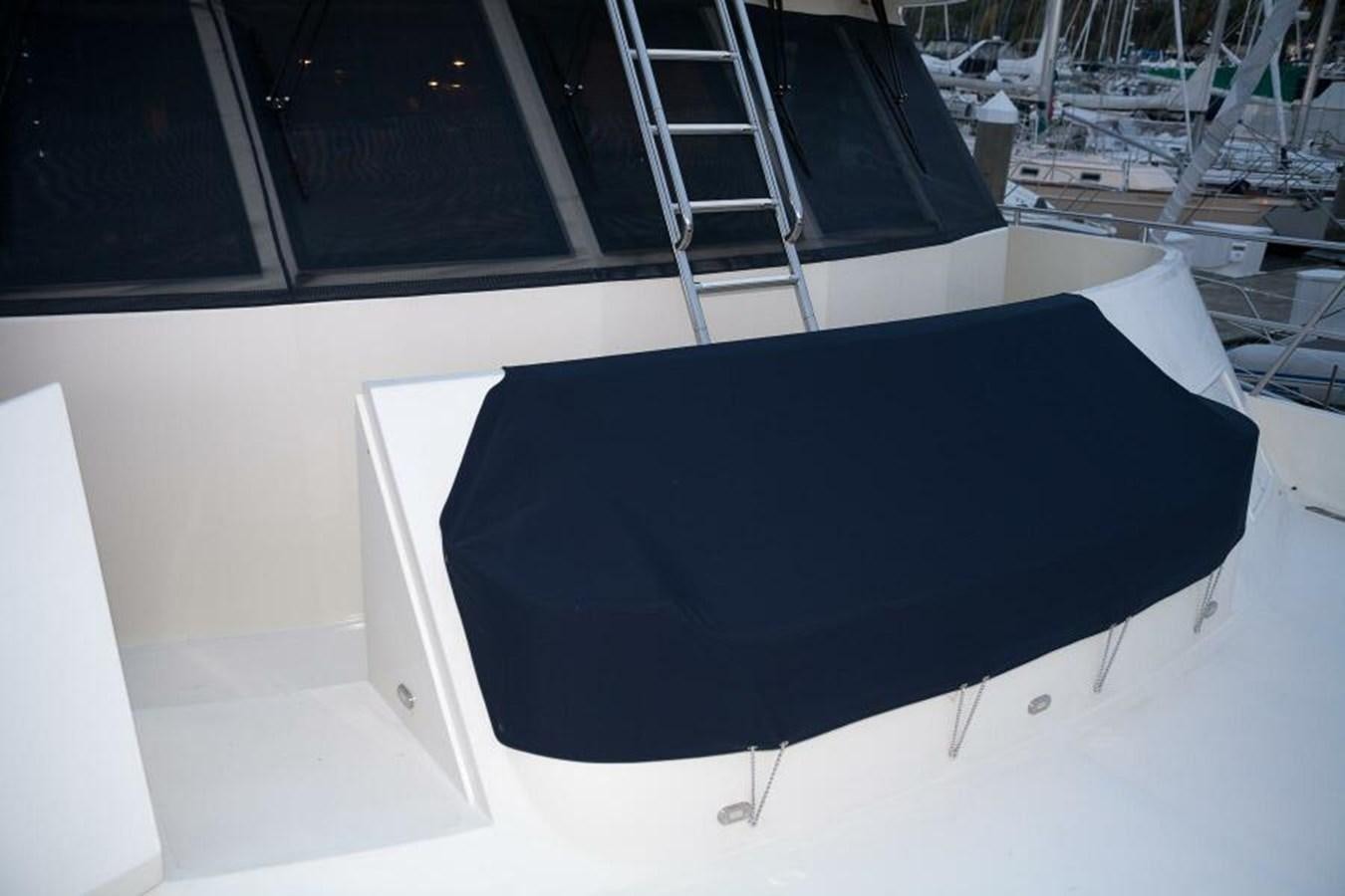 a black umbrella on a white surface aboard AL DI LA Yacht for Sale