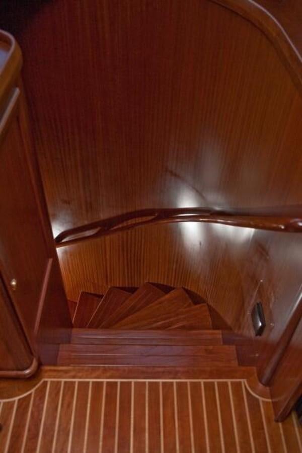 a kitchen with wooden cabinets aboard AL DI LA Yacht for Sale