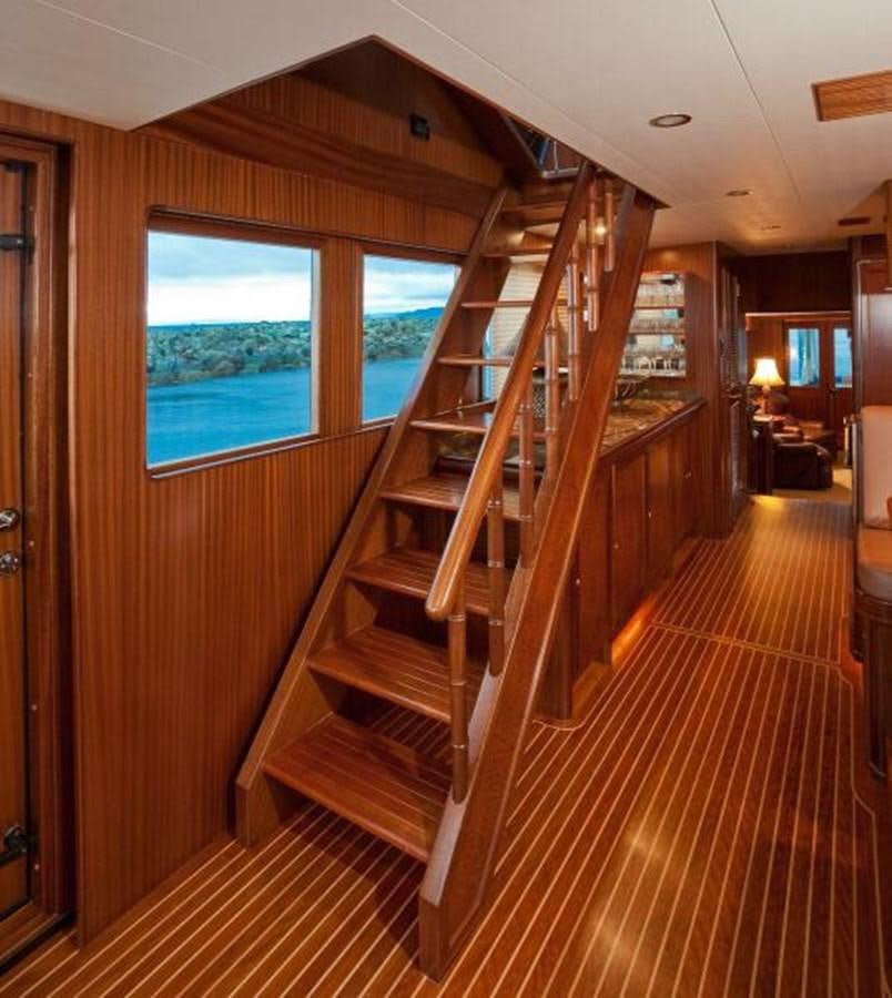 a wooden staircase in a house aboard AL DI LA Yacht for Sale