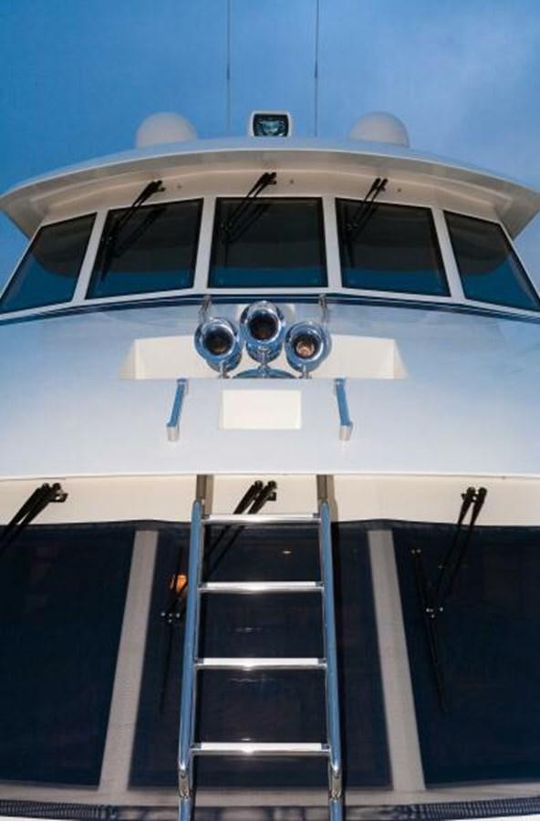 a white and blue car aboard AL DI LA Yacht for Sale