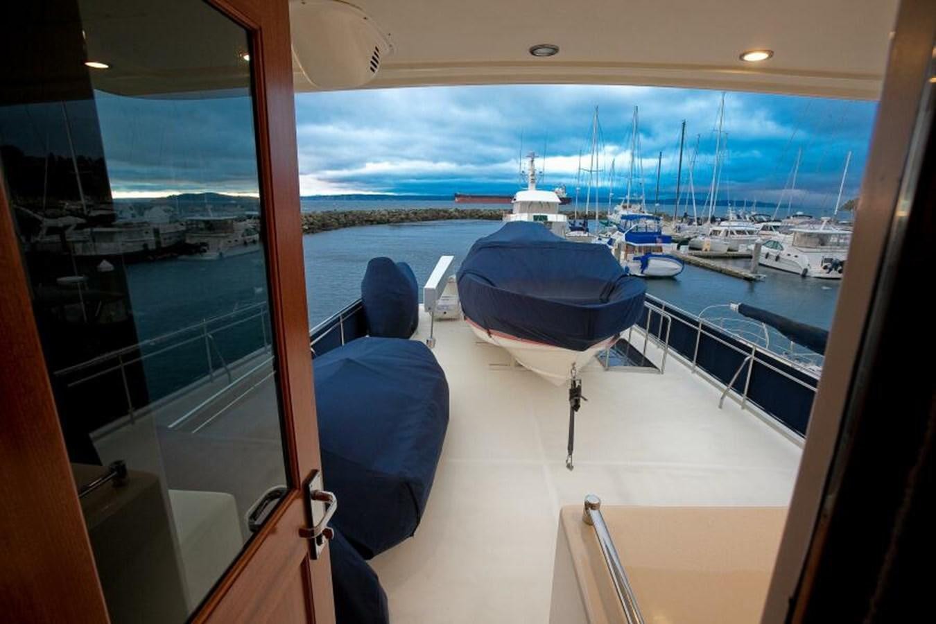 a room with a view of the water and boats aboard AL DI LA Yacht for Sale