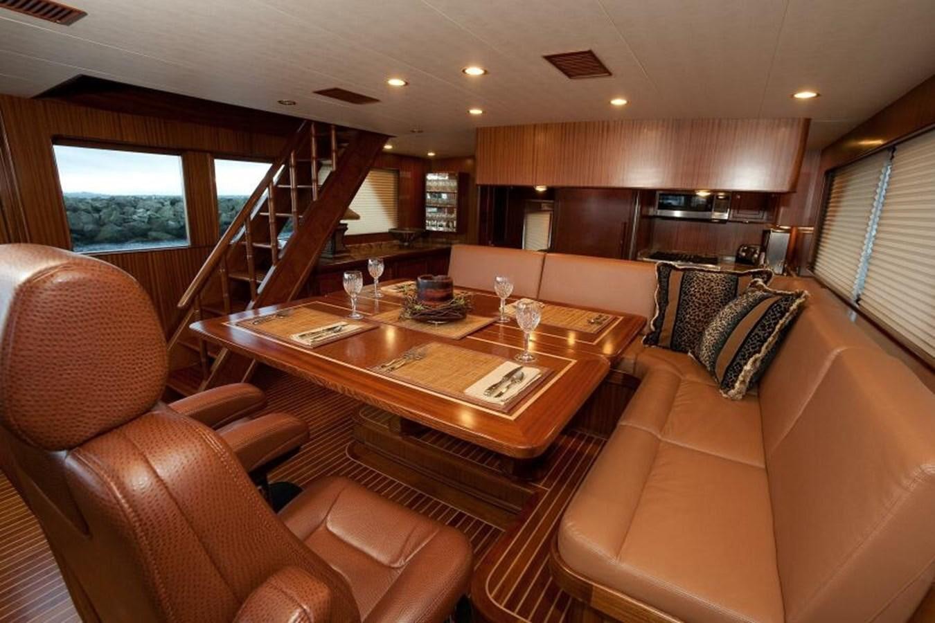 a living room with a large table aboard AL DI LA Yacht for Sale