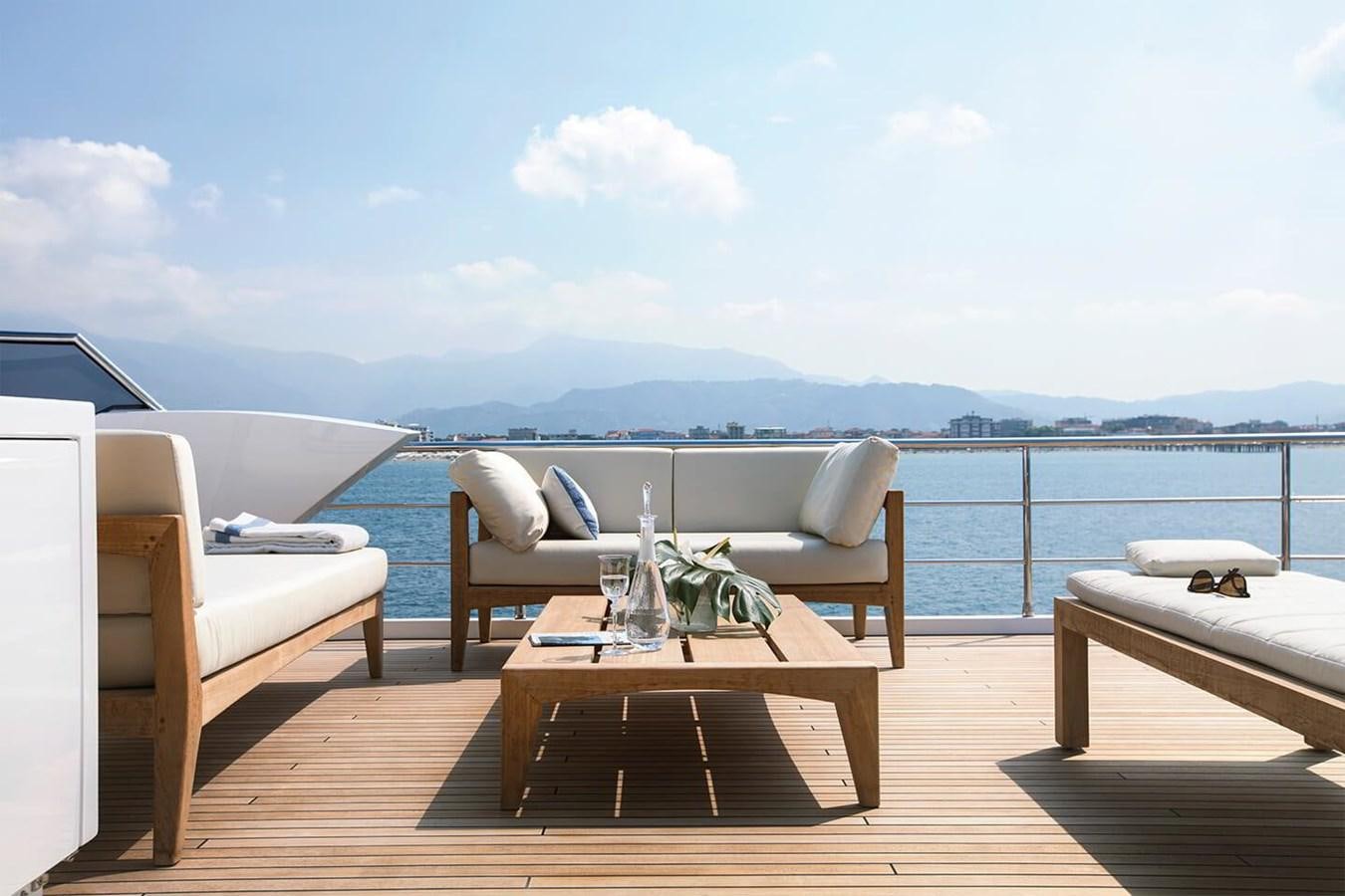 a room with a table and chairs aboard 2019 AZIMUT GRANDE 35 M/Y HEED Yacht for Sale