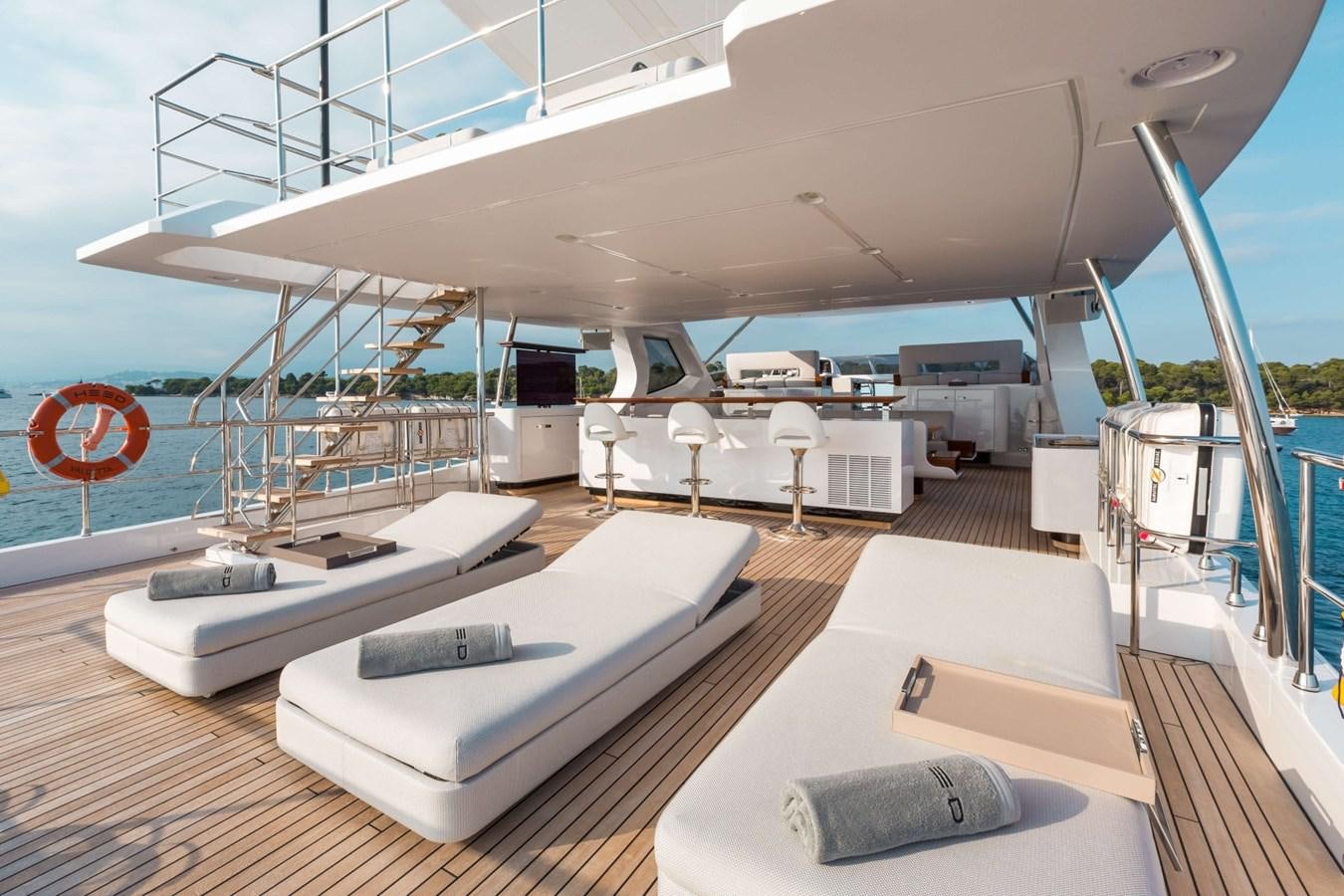 a large room with a bed and a large white table aboard 2019 AZIMUT GRANDE 35 M/Y HEED Yacht for Sale