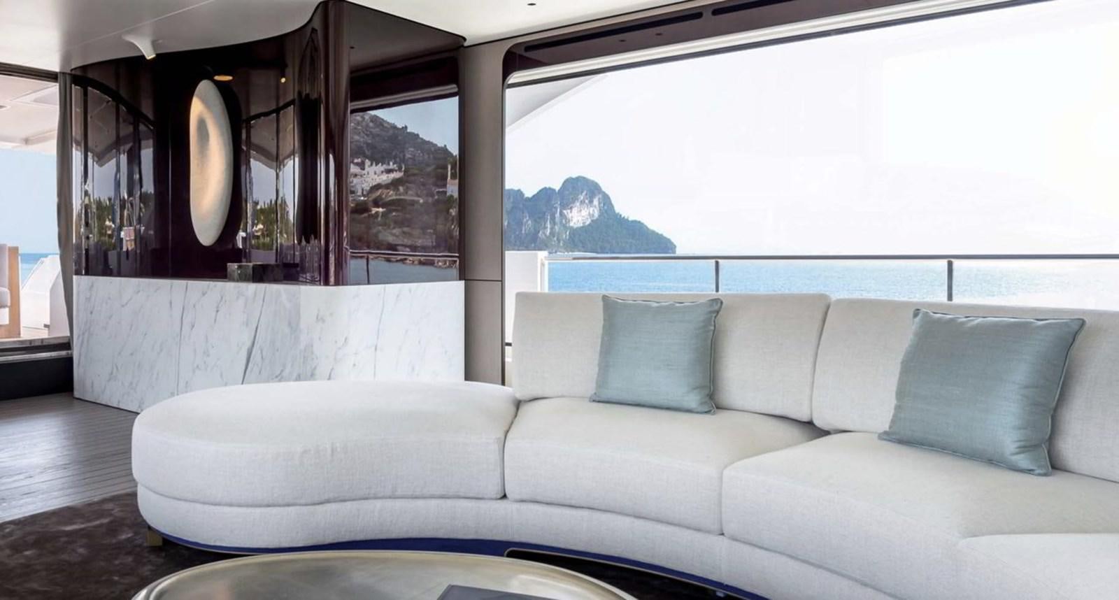 a couch in a room aboard 2019 AZIMUT GRANDE 35 M/Y HEED Yacht for Sale