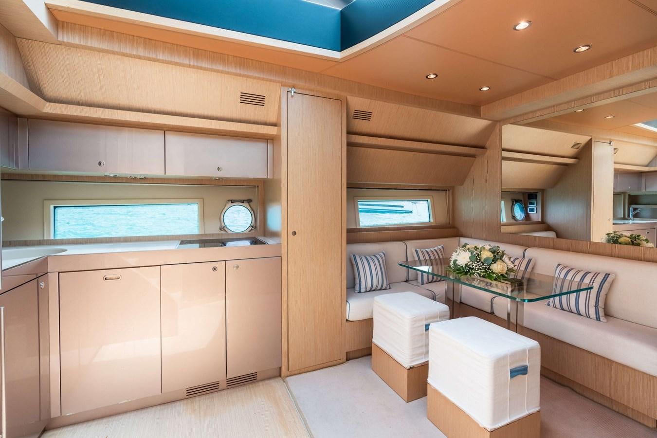 a room with a couch and a table aboard 2008 RIVA SUPER EGO 68 Yacht for Sale