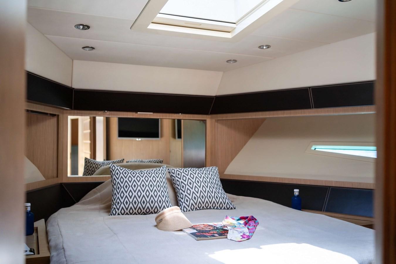 a bed with pillows and pillows aboard 2008 RIVA SUPER EGO 68 Yacht for Sale