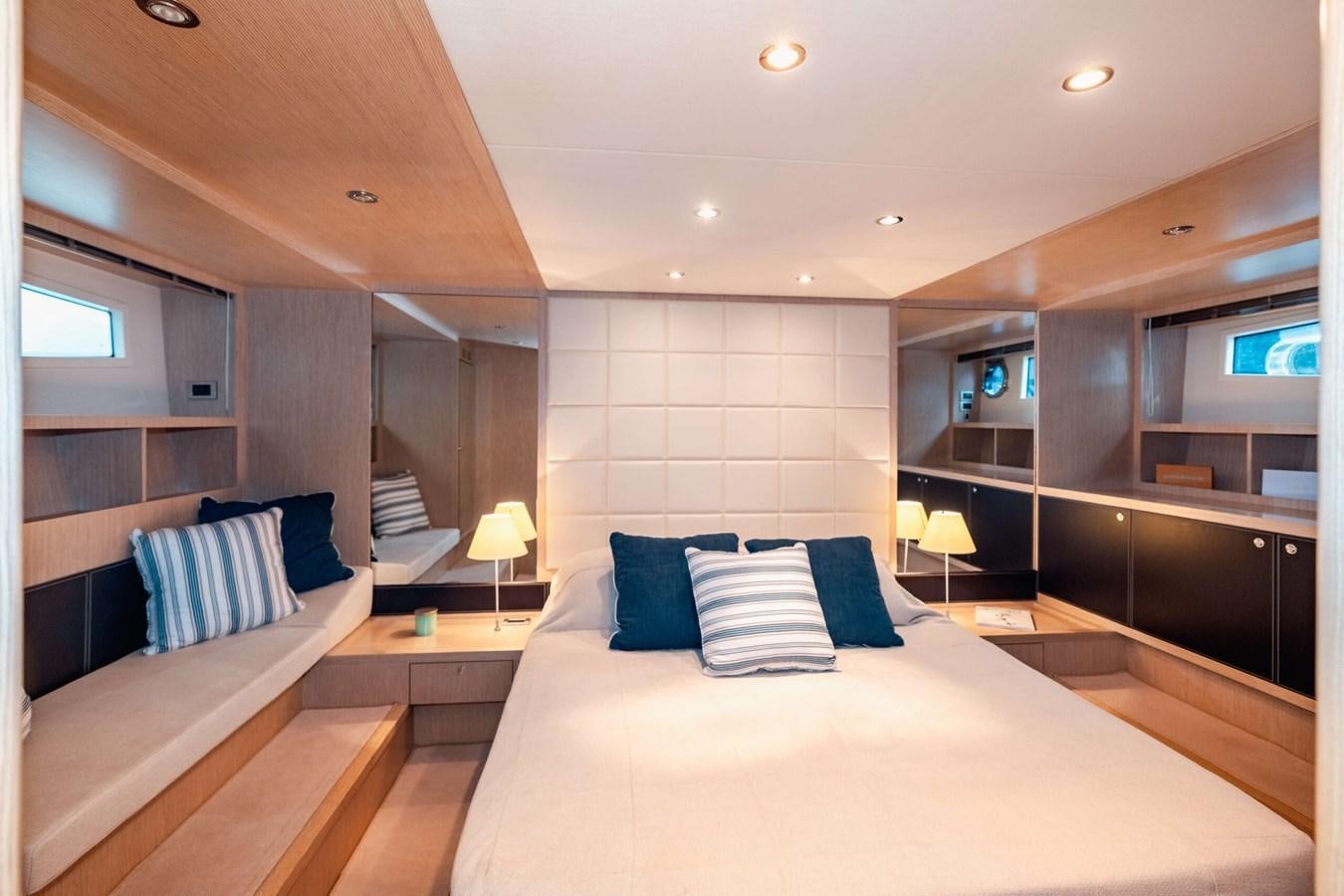 a room with a bed and a window aboard 2008 RIVA SUPER EGO 68 Yacht for Sale
