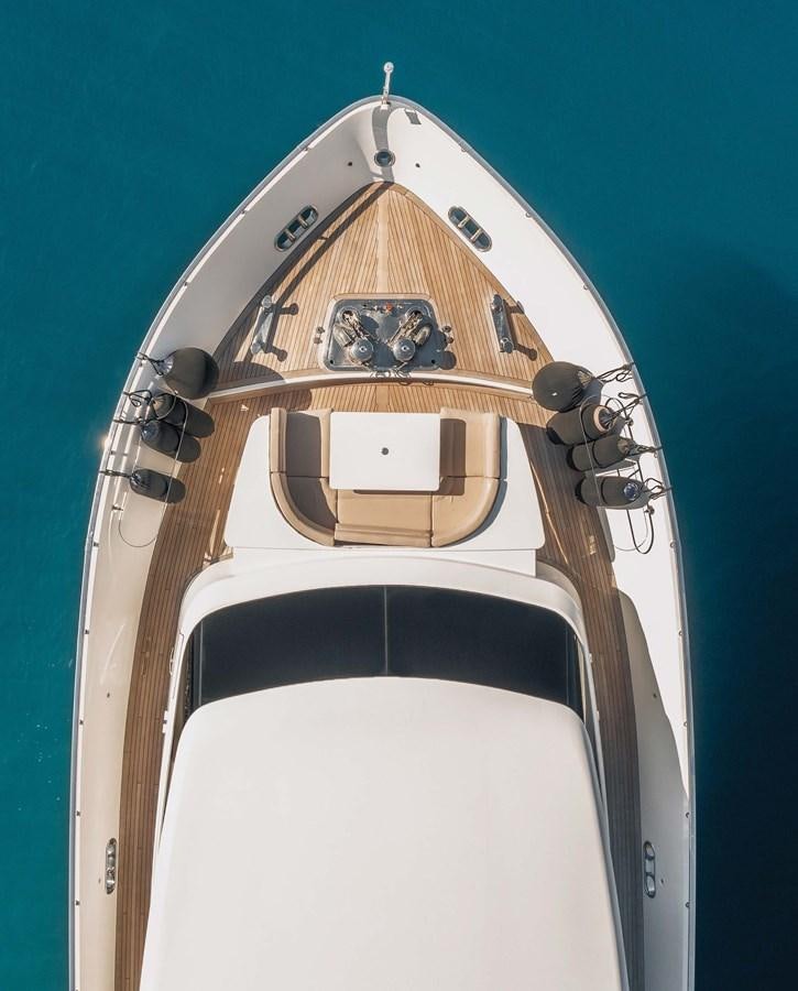 a white toilet with a seat aboard 2009 SANLORENZO SL88 #541 Yacht for Sale