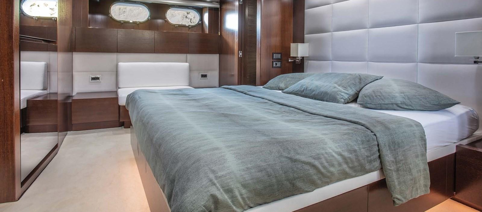 a bed in a room aboard 2009 SANLORENZO SL88 #541 Yacht for Sale