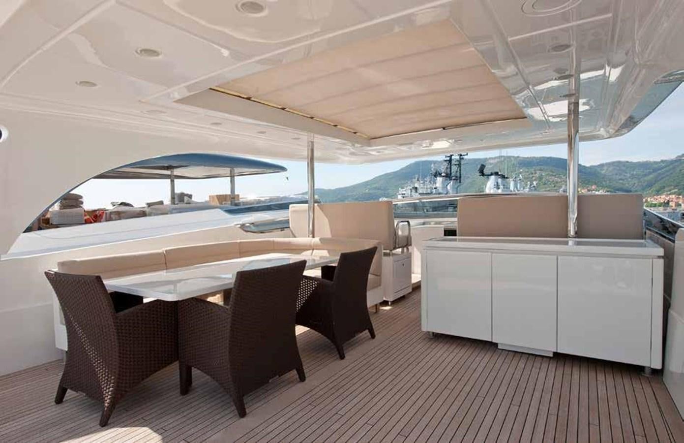 a large white boat with chairs around it aboard 2009 SANLORENZO SL88 #541 Yacht for Sale