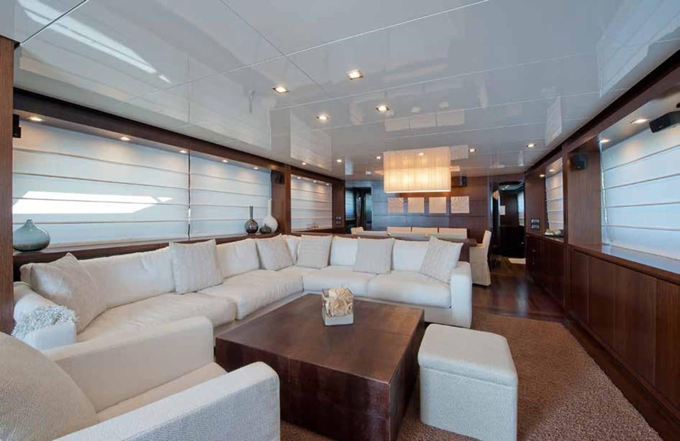 a living room with a couch and a coffee table aboard 2009 SANLORENZO SL88 #541 Yacht for Sale