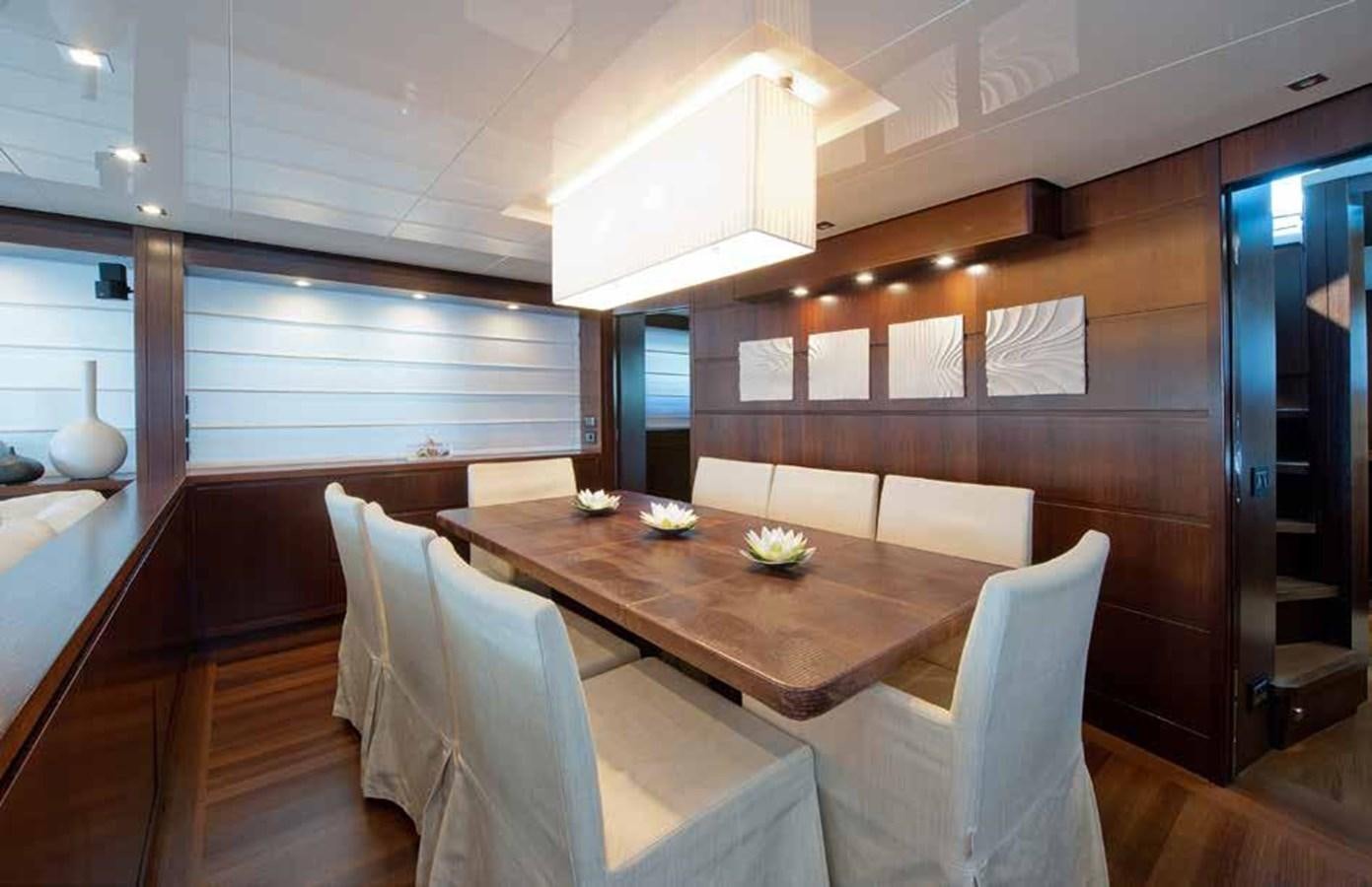 a room with a table and chairs aboard 2009 SANLORENZO SL88 #541 Yacht for Sale