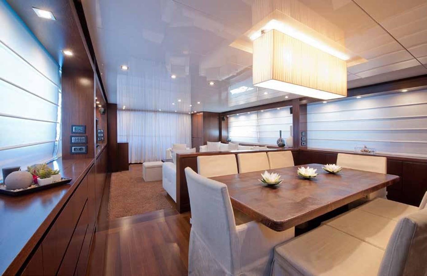 a large kitchen with a table aboard 2009 SANLORENZO SL88 #541 Yacht for Sale