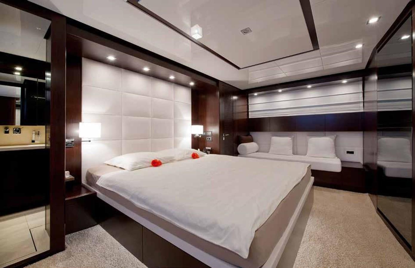 a room with a bed and a mirror aboard 2009 SANLORENZO SL88 #541 Yacht for Sale