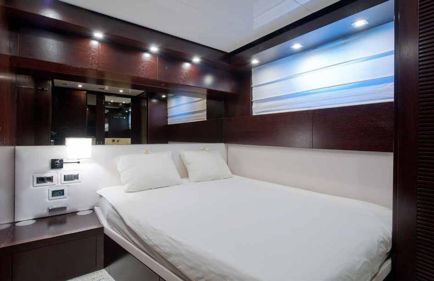 a room with a bed and a window aboard 2009 SANLORENZO SL88 #541 Yacht for Sale