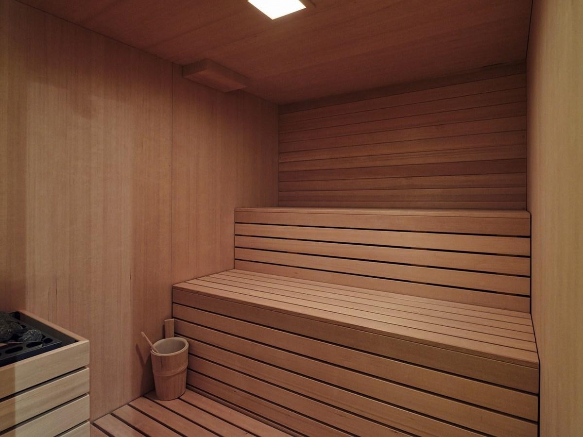 a room with wooden walls aboard AKULA Yacht for Sale