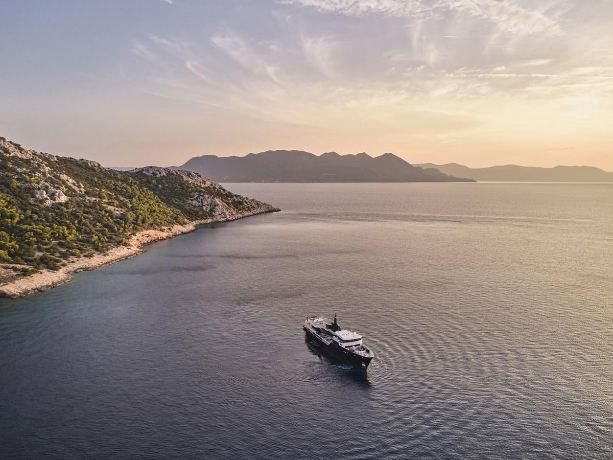 a boat sailing on the water aboard AKULA Yacht for Sale